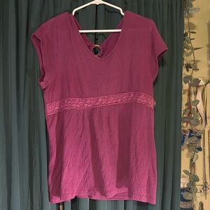 Short sleeve purple top with cut out back.  Size XL